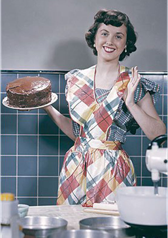'50s housewife holding a cake
