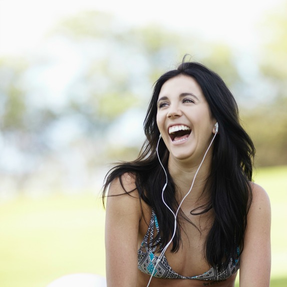 woman laughing with headphones