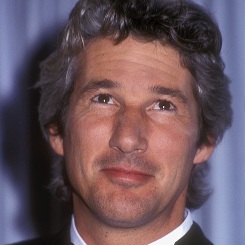 Young Richard Gere wearing a suit