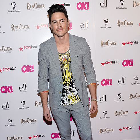 Tom Sandoval in a grey suit and flashy shirt