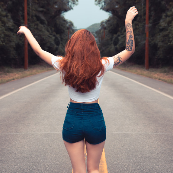 redhead woman on a road