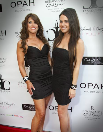Alexa and Lynne pose on a red carpet