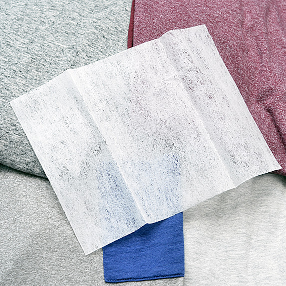Fabric softener sheet on folded laundry