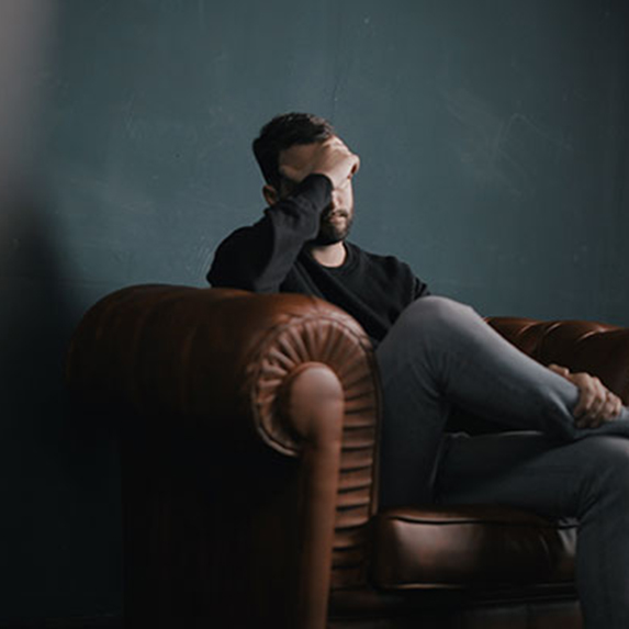 man stressed out in corner