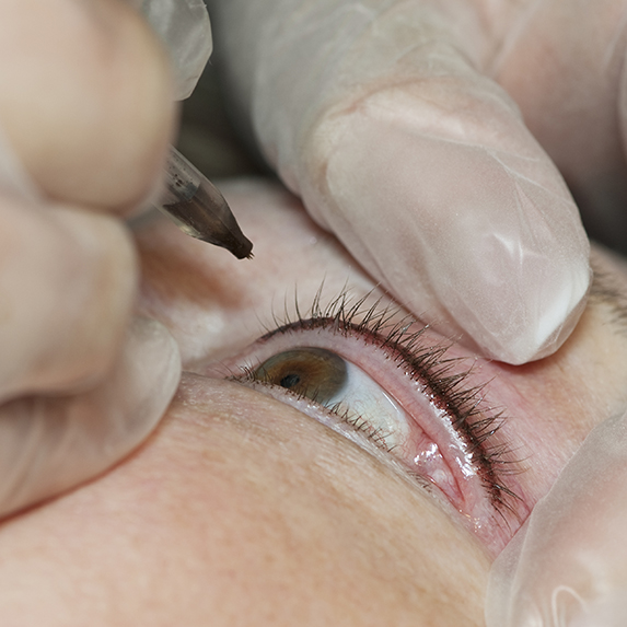 Close up of permanent makeup (tattoo) being applied to eye.