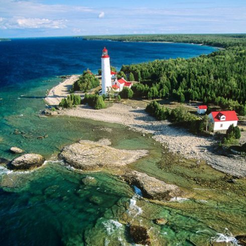 Arial shot of Bruce Peninsula coast with a lighthouse