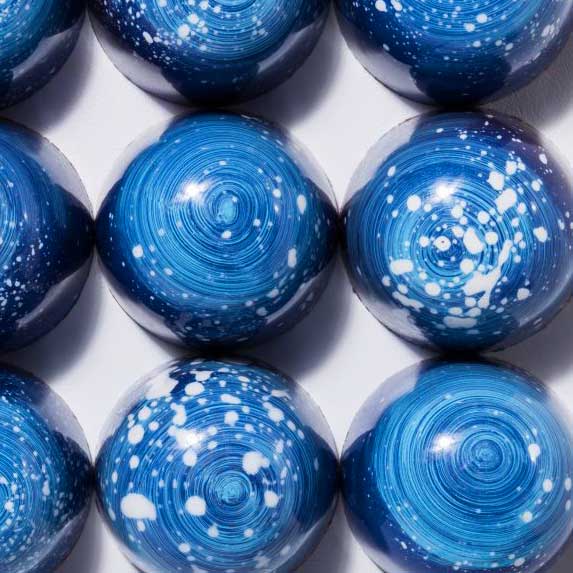 A photo of blue chocolate bon bons