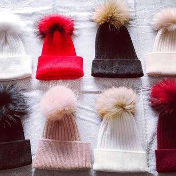 Cute pom pom hats in a variety of colours