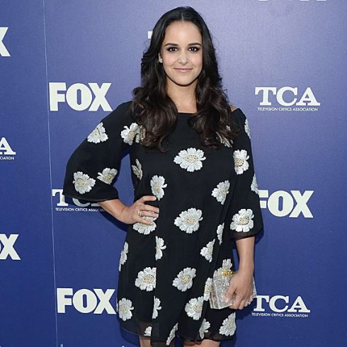 Melissa Fumero posing and smiling at an event