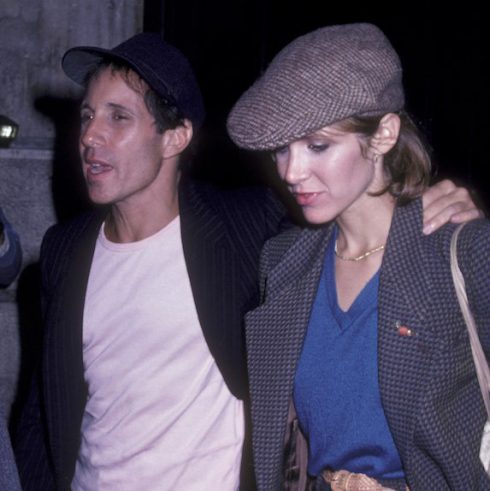 Carrie Fisher and Paul Simon, mid-stride