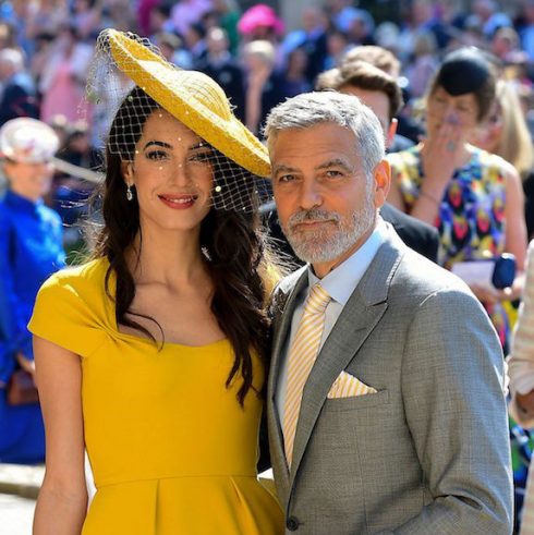 George Clooney and Amal Alamuddin at an outdoor event, dressed up