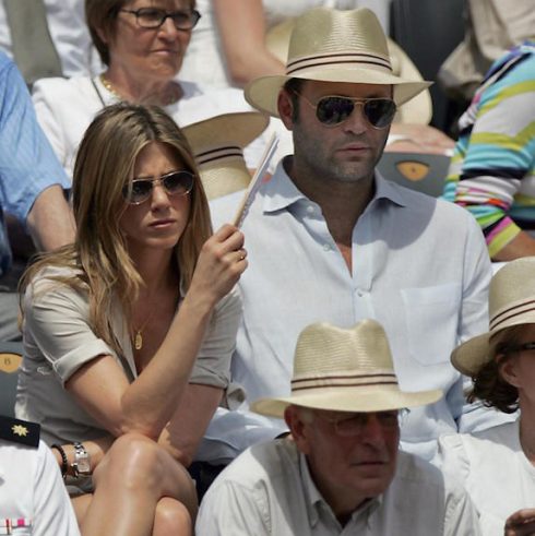 Jennifer Aniston and Vince Vaughan at an outdoor event mid-conversation