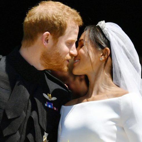 Prince Harry and Meghan Markle seal their wedding with a kiss