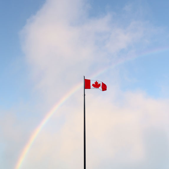Canadian flag and a rainbow