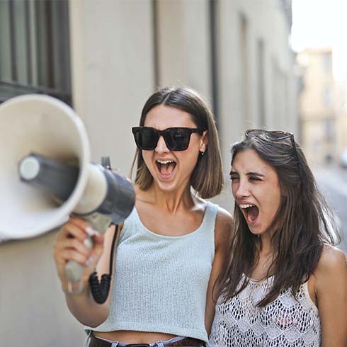 Two young women with one holding megaphone