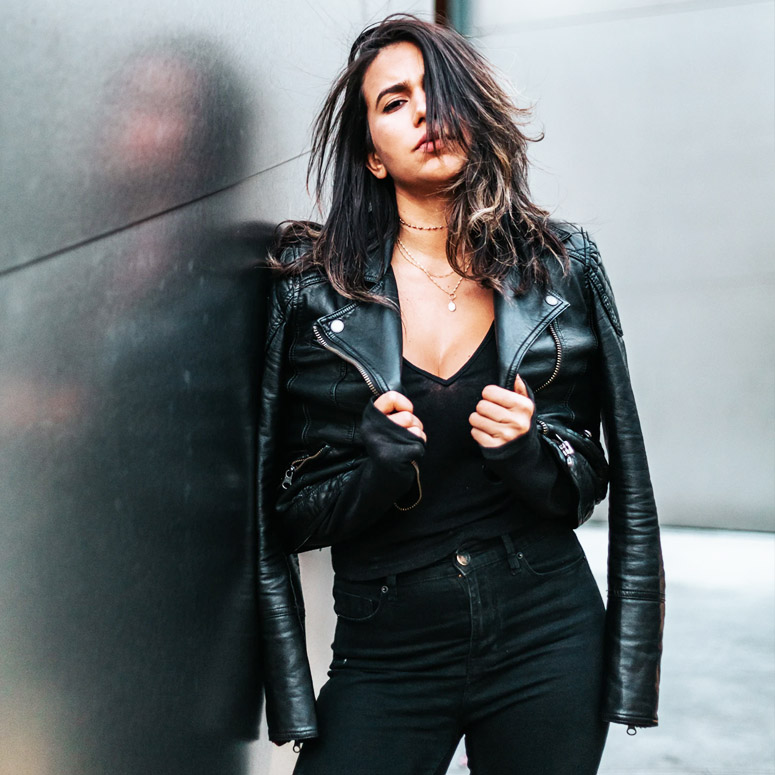 Woman sports a leather jacket ready for fall