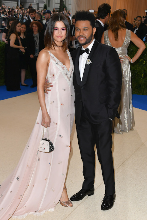Selena Gomez poses with then-boyfriend The Weeknd at the MET Gala in 2017