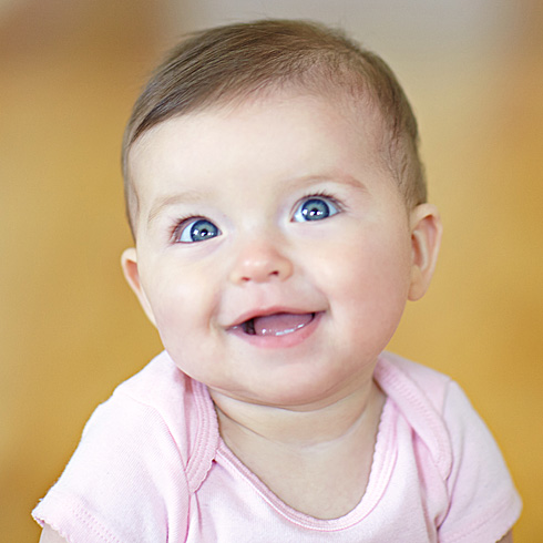 Smiling baby girl in pink