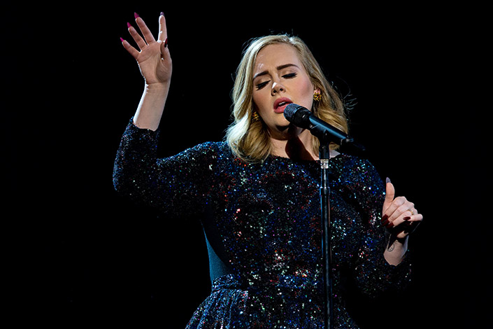 Adele performing live on stage