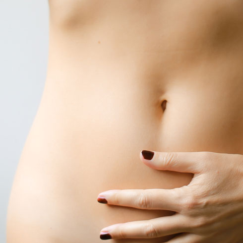 A woman holding her stomach
