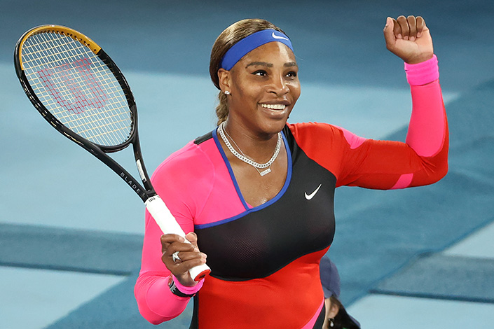 Serena Williams of the US celebrates beating Romania's Simona Halep during their women's singles quarter-final match on day nine of the Australian Open tennis tournament in Melbourne on February 16, 2021. 