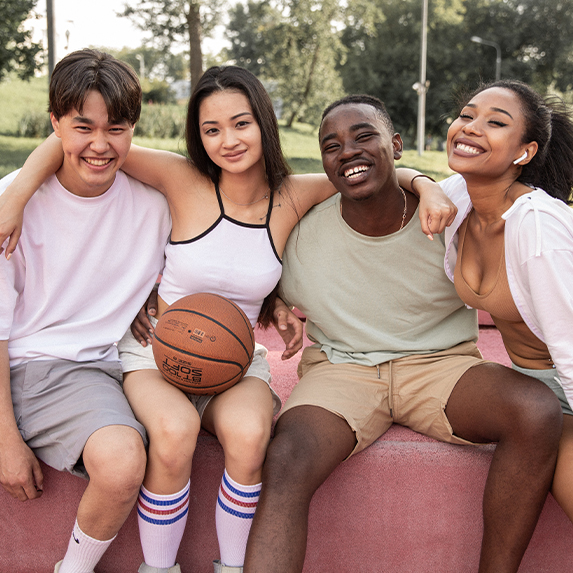 A group of friends with a basketball