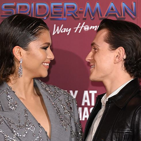 Zendaya and Tom Holland looking at each other