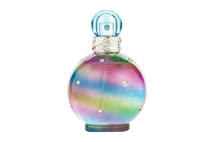 a colourful circular bottle of perfume