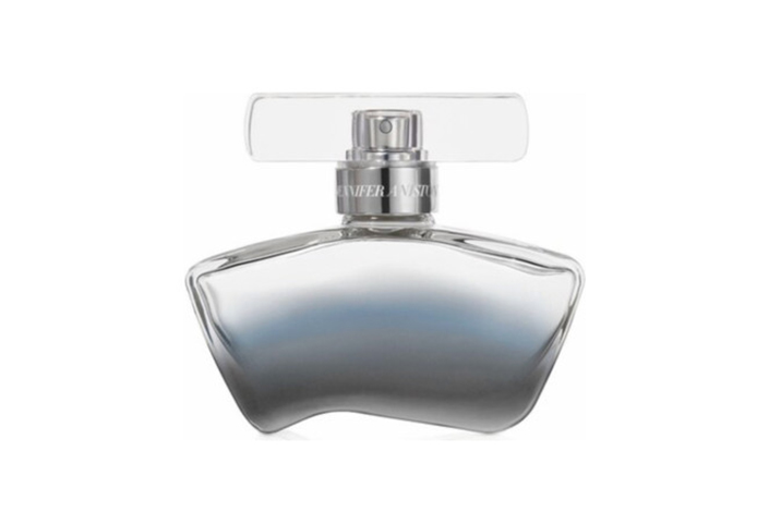 a uniquely shaped silver bottle of perfume