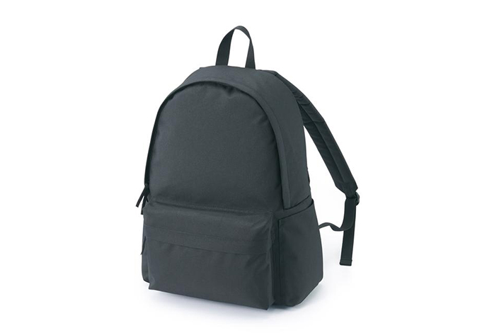 a minimalist black waterproof backpack against a white background