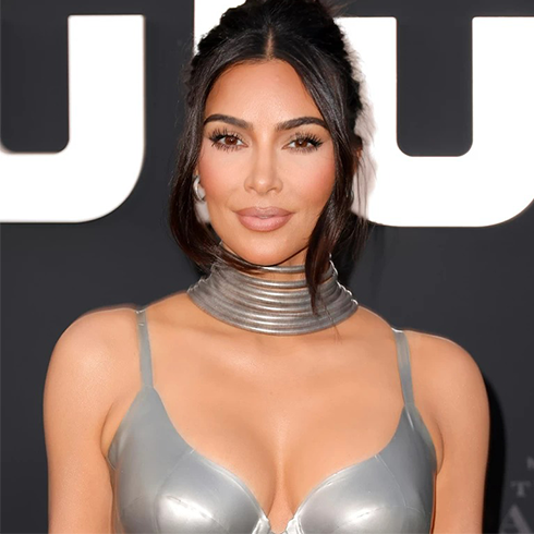 Kim Kardashian in a grey dress