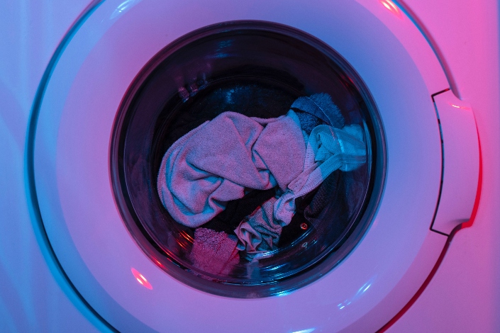 A washing machine filled with clothes