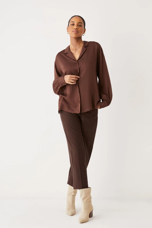 Model in brown satin shirt