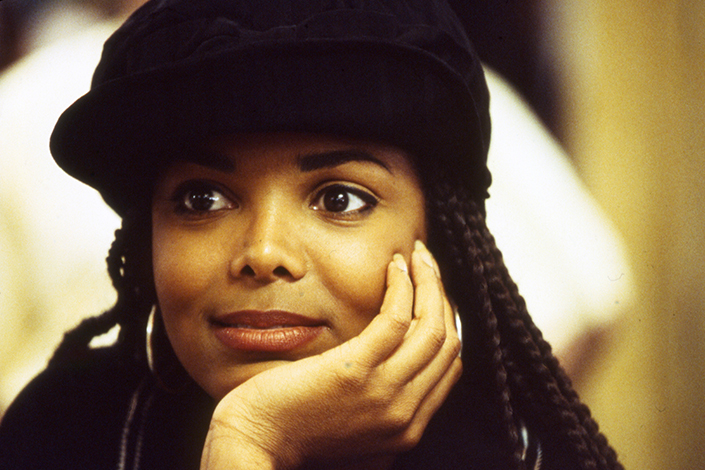 Janet Jackson in her role for Poetic Justice with braids and a hat