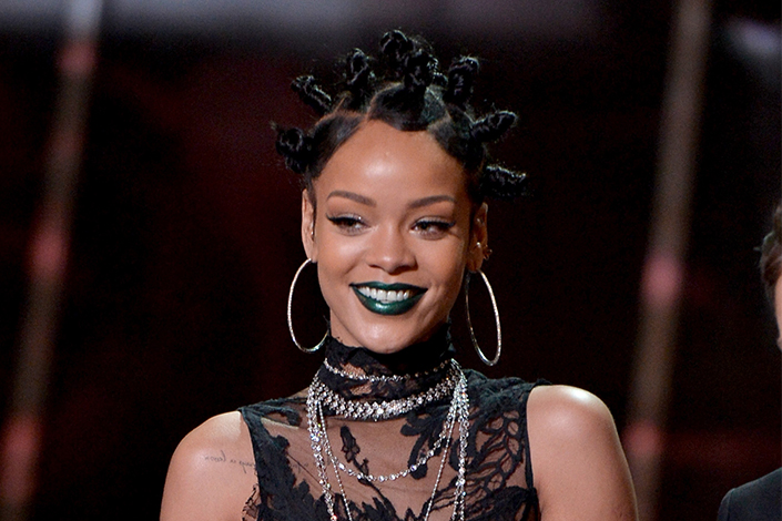 Rihanna wearing bantu knots and large hoop earrings