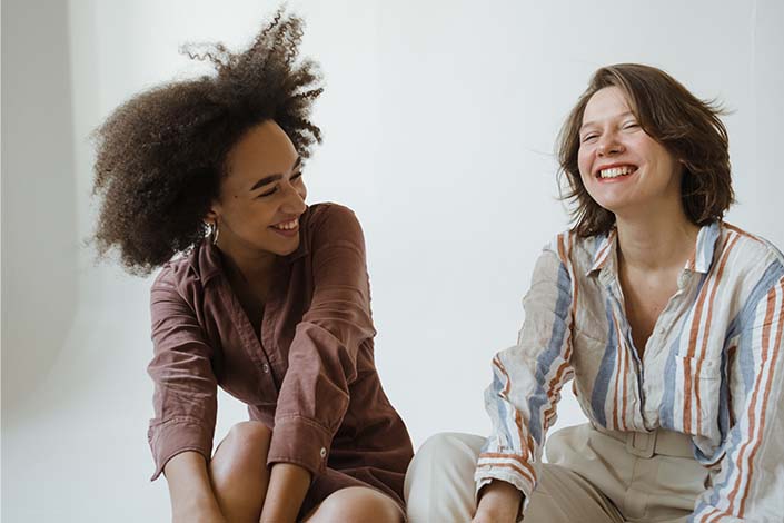 Two women laughing together