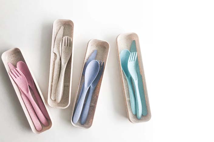 Four sets of pastel-coloured cutlery 