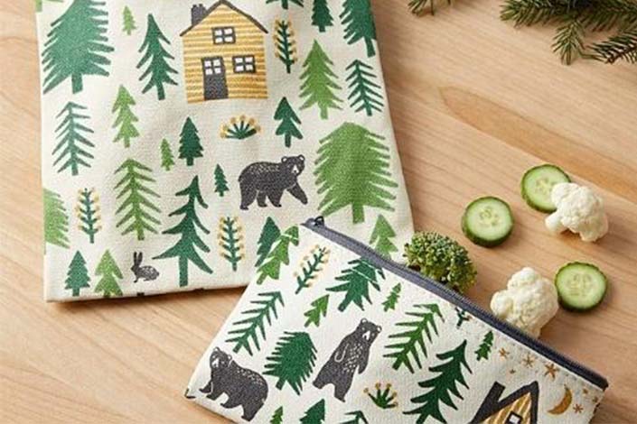 wo snack bags with a cottage-theme pattern with bears, trees and cottages.