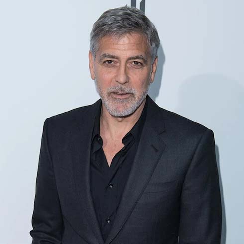 George Clooney in a suit at an event