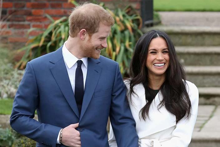 Prince Harry and Meghan Markle during an official photocall to announce the engagement of Prince Harry and actress Meghan Markle at The Sunken Gardens at Kensington Palace on November 27, 2017 in London, England.