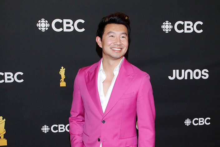 Simu Liu in a pink suit