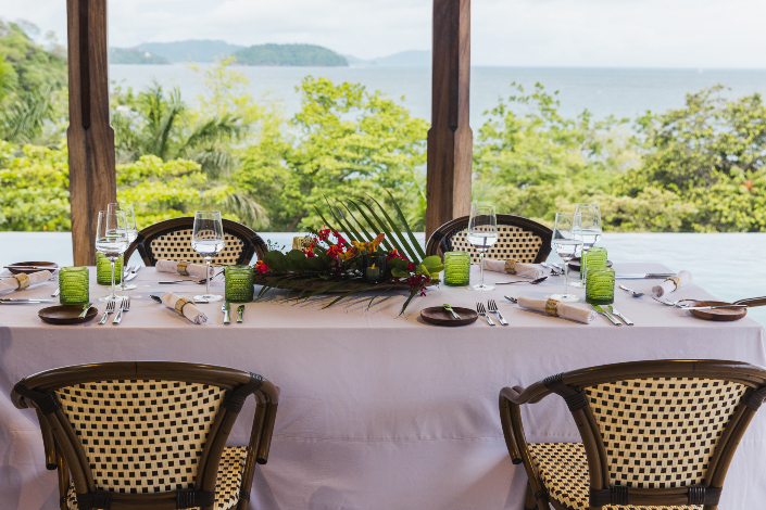 An outdoor dining table overlooking the town of Las Catalinas in Costa Rica