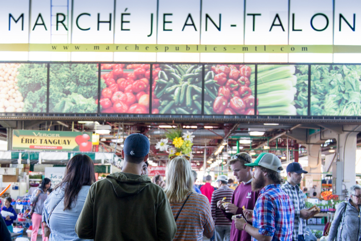 A group of people outside the Jean Talon Market in Montreal