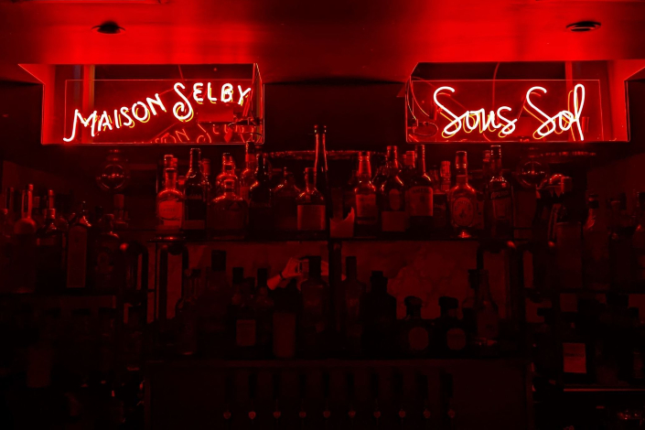An elegant bar with neon red lighting