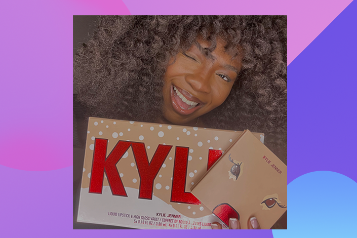 Ria holding the Kylie Cosmetics lip vault and pressed powder palette