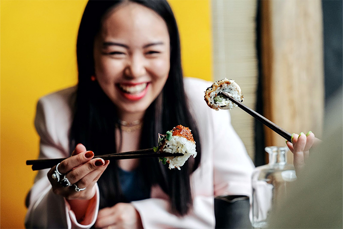 A woman with sushi