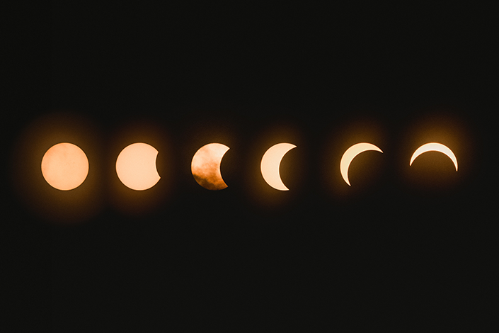 the phases of the moon on a dark background