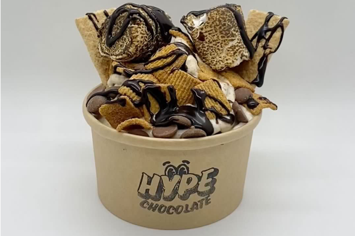 A dessert in a "Hype Chocolate" cup