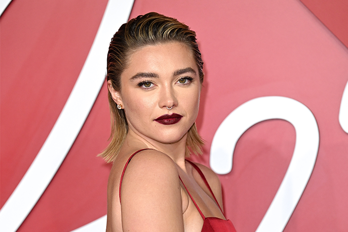 Florence Pugh with wet-look hair and dark red lips