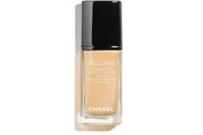 A product shot of a glass bottle of Chanel Vitalumiere Foundation